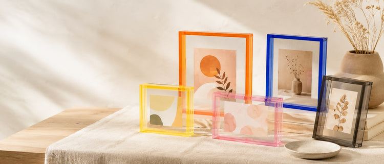 ColorPop Acrylic Frames collection banner styled on a warm linen surface with colorful transparent acrylic photo frames