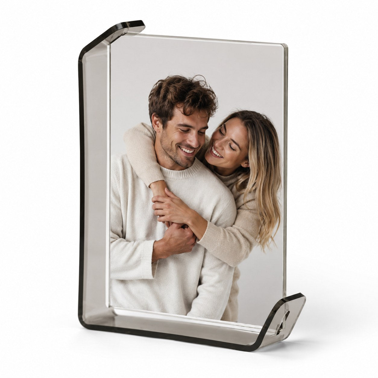 Curved clear tabletop photo frame in smoke gray finish, vertical orientation