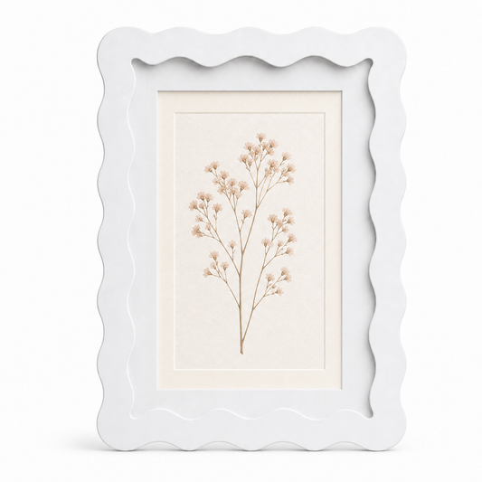 White wavy-edge glass photo frame with botanical art insert on white background
